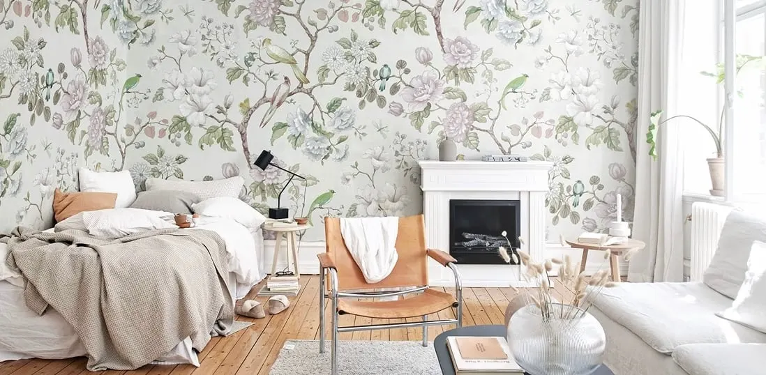large-scale floral wallpaper in soft greens and grays